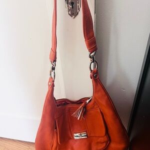 Orange leather Pulicati shoulder/crossbody bag.